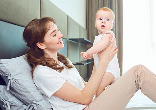 A mother holding her baby